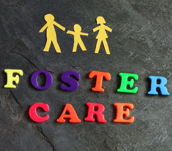Paper family of three with Foster Care letters